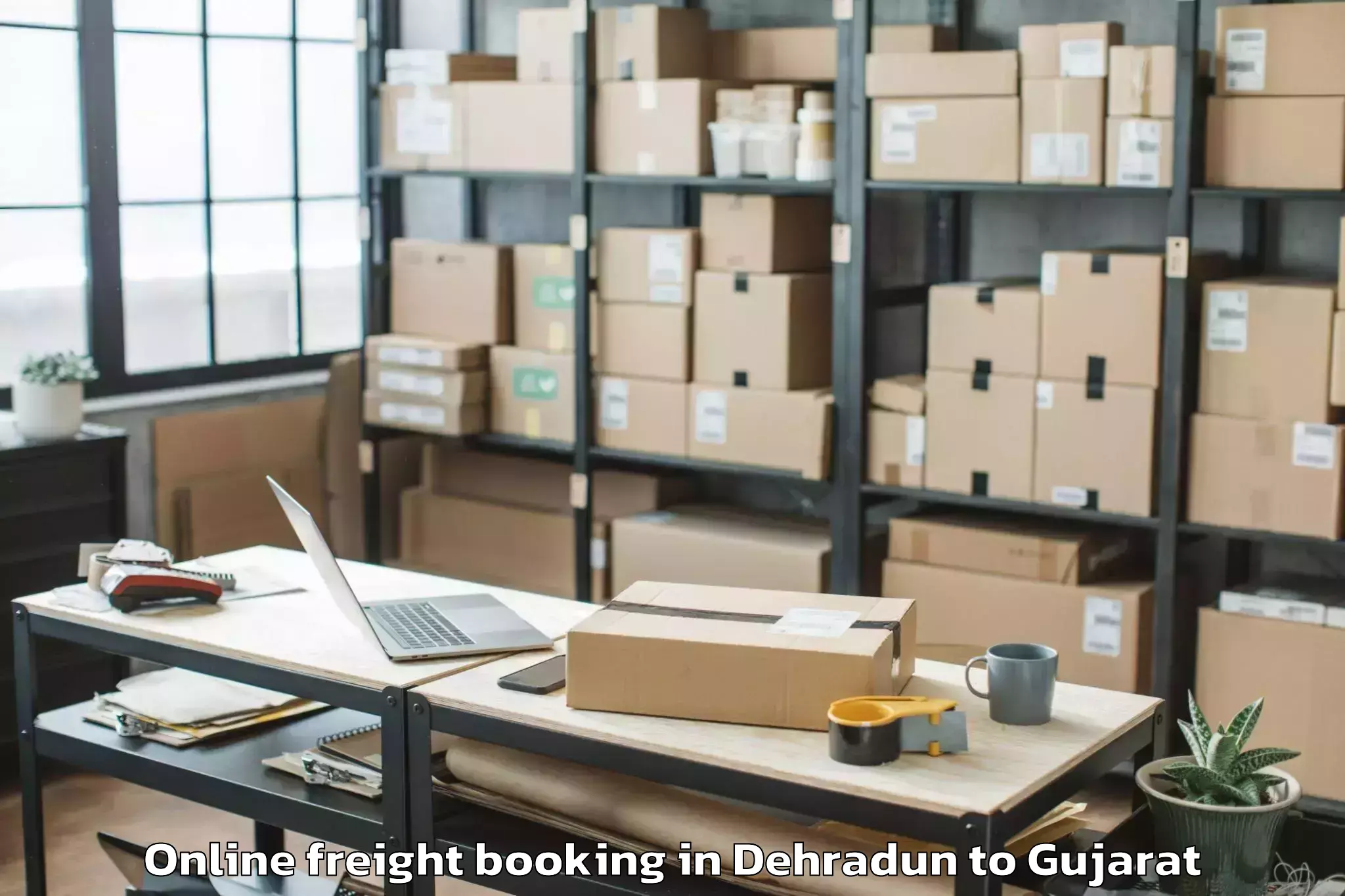 Book Dehradun to Vaghodia Ina Online Freight Booking